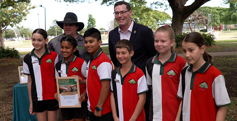 Mayor Troy Thompson and Ranger Dan presenting Annandale State School students with a Schools Tree Day certificate ahead of National Tree Day this weekend.