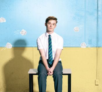 A boy on a school chair