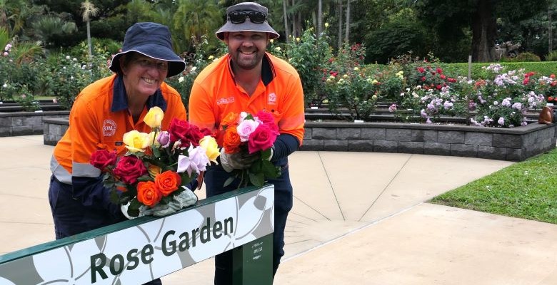 Townsville City Council maintenance team leader Naomi Shoobridge and gardener Nick Coombes with a selection of roses for a rose display at the 2024 Townsville Show