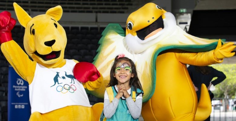 Girl with Olympic/Paralympic mascots