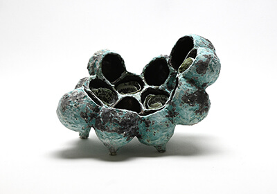 Lilach Mileikowski Nestled 2023, Stoneware clay, porcelain slip, layered ceramic glaze materials, textured fabric, screen-print stain application, dry glazes, multiple firing, 21 x 30 x 16 cm